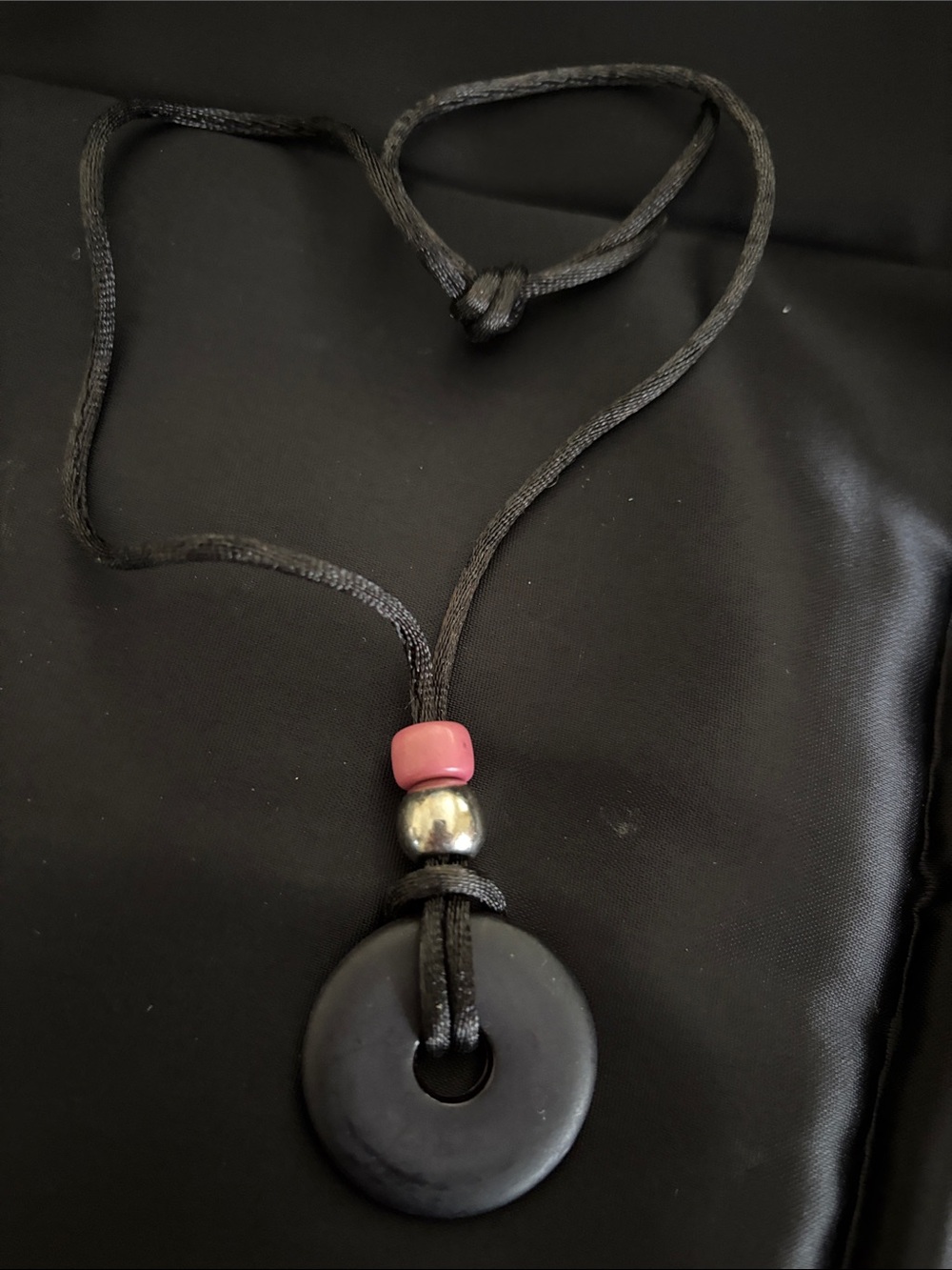 Black Disk Pendant Necklace with Pink Accent Bead